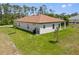 Aerial view of a single story home with a well-maintained backyard and lush landscaping at 3779 Clearfield St, North Port, FL 34286