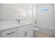 Bathroom featuring a modern vanity, sleek fixtures, and a tiled shower/tub combo, combining style with functionality at 3779 Clearfield St, North Port, FL 34286