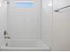 Clean bathroom showcasing a tiled shower/tub, providing a serene and relaxing bathing experience at 3779 Clearfield St, North Port, FL 34286