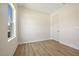 Bright bedroom with wood-look floors, natural light and neutral color palette create a warm and inviting space at 3779 Clearfield St, North Port, FL 34286