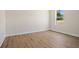 Inviting bedroom with wood-look floors, offers a comfortable and stylish retreat within the home at 3779 Clearfield St, North Port, FL 34286