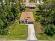 Aerial view showcases the home's location and surrounding landscape with ample trees at 3802 Eagle Pass St, North Port, FL 34286