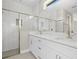 Bathroom features modern vanity with quartz countertop, glass-enclosed shower with tiled walls at 3883 Dominic St, North Port, FL 34288