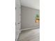 Bright bedroom with gray walls, wood-look floors, white trim, and a view of the fenced-in backyard at 3883 Dominic St, North Port, FL 34288