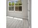 Bedroom features a large window for natural light and modern flooring at 3883 Dominic St, North Port, FL 34288
