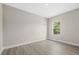 Bright bedroom with wood-look floors and a window at 3885 Eagle Pass St, North Port, FL 34286