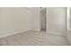 Bright bedroom features neutral walls, white trim, and neutral flooring throughout at 3885 Eagle Pass St, North Port, FL 34286