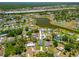 Aerial view showcases the neighborhood's layout, lake and the location of the property at 4131 Bula Ln, North Port, FL 34287