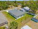 An aerial view of the home reveals a lush green lawn and neighboring homes in a tranquil neighborhood at 4131 Bula Ln, North Port, FL 34287