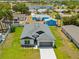 Beautiful aerial view of a single Gathering home, showcasing its landscaping, driveway, and roof at 4131 Bula Ln, North Port, FL 34287