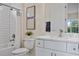Bathroom featuring vanity, subway tile, tub/shower combo and decorative accents at 4131 Bula Ln, North Port, FL 34287