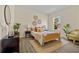 Cozy bedroom with a comfortable bed, decorative wall hangings, and ample natural light at 4131 Bula Ln, North Port, FL 34287