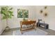 Bright office space with a modern desk, decorative plants, and a comfortable seating area at 4131 Bula Ln, North Port, FL 34287