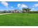 Charming single-Gathering home with a lush lawn, a neatly paved driveway, and a beautiful facade at 4637 Irdell Ter, North Port, FL 34288
