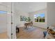 Bright office with a large window, wooden desk, and stylish decor, perfect for working from home at 4637 Irdell Ter, North Port, FL 34288