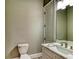 Elegant bathroom with white vanity, quartz countertop and a view of the pool at 5179 Collingswood Blvd, Port Charlotte, FL 33948