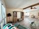 Living room with neutral colored sofa and an ottoman at 747 Tangerine Woods Blvd, Englewood, FL 34223