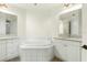 Bathroom with a large garden tub and double vanity at 95 Vivante Blvd # 9534, Punta Gorda, FL 33950