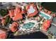 Aerial view of community pool and surrounding buildings at 95 Vivante Blvd # 9534, Punta Gorda, FL 33950