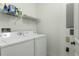 Functional laundry room with washer, dryer, and shelving at 95 Vivante Blvd # 9534, Punta Gorda, FL 33950