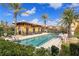 Resort-style pool with palm trees at 95 Vivante Blvd # 9534, Punta Gorda, FL 33950