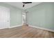 Light and airy bedroom with wood-look floors and access to bathroom at 95 Vivante Blvd # 9534, Punta Gorda, FL 33950