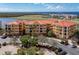 Aerial view of a luxurious condo building with water views at 95 Vivante Blvd # 9534, Punta Gorda, FL 33950