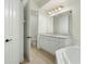 Updated bathroom with white cabinets, granite countertops, and a soaking tub at 95 Vivante Blvd # 9534, Punta Gorda, FL 33950