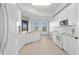 Modern kitchen with white cabinets, granite counters, and breakfast bar at 95 Vivante Blvd # 9534, Punta Gorda, FL 33950