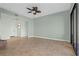 Living room with tiled floors and access to balcony and entryway at 95 Vivante Blvd # 9534, Punta Gorda, FL 33950