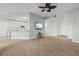 Open concept living room and kitchen with tile floors and neutral colors at 95 Vivante Blvd # 9534, Punta Gorda, FL 33950