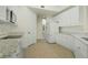 Modern kitchen featuring white cabinets and granite countertops at 95 Vivante Blvd # 9534, Punta Gorda, FL 33950