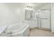 Bathroom with a soaking tub, shower, and granite vanity at 95 Vivante Blvd # 9534, Punta Gorda, FL 33950