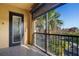 Spacious balcony with view of tropical landscape and resort amenities at 95 Vivante Blvd # 9534, Punta Gorda, FL 33950