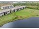 Aerial view of condo building and expansive lawn at 175 Kings Hwy # 718, Punta Gorda, FL 33983