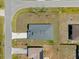 An aerial view displays the home's new roof and well-maintained lawn at 1100 S Wapello St, North Port, FL 34286
