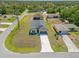 Charming single Gathering home with a sprawling front yard and long driveway at 1100 S Wapello St, North Port, FL 34286