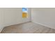 Bedroom featuring wood-look floors, white walls and window at 1100 S Wapello St, North Port, FL 34286