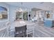 Open concept dining area with view of Gathering room, kitchen, and pool at 1450 Kiwi Ct, Punta Gorda, FL 33950