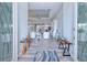 Bright and spacious entryway with wood-look floors and access to living areas at 1450 Kiwi Ct, Punta Gorda, FL 33950