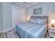 Spacious bedroom with king-size bed and double doors to closet at 1450 Kiwi Ct, Punta Gorda, FL 33950