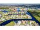 Wide aerial showcasing waterfront homes and canals at 1450 Kiwi Ct, Punta Gorda, FL 33950