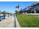 Concrete boat dock with a walkway leading to a canal at 1450 Kiwi Ct, Punta Gorda, FL 33950