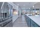 Open concept kitchen with stainless steel appliances and an island at 1450 Kiwi Ct, Punta Gorda, FL 33950