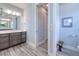 Bathroom with double vanity and walk-in shower at 1450 Kiwi Ct, Punta Gorda, FL 33950