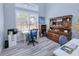Home office with built-in shelving, desk, and comfortable chair at 1450 Kiwi Ct, Punta Gorda, FL 33950