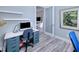 Home office with a desk, chair, and view into another room at 1450 Kiwi Ct, Punta Gorda, FL 33950