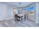 Bright breakfast nook with a table and chairs, lots of windows and wood-look flooring at 1450 Kiwi Ct, Punta Gorda, FL 33950
