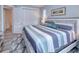 Serene bedroom with king-size bed, soft color palette, and ample closet space at 1450 Kiwi Ct, Punta Gorda, FL 33950