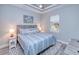 Main bedroom with king-size bed, wood headboard, and blue bedding at 1450 Kiwi Ct, Punta Gorda, FL 33950